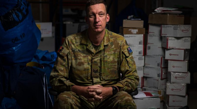 Australian Army Sergeant Alexander Landel in the Joint Task Force 633 post office, while deployed to Operation Accordion in the Middle East region. Story by Flight Lieutenant Clarice Hurren. Photo by Sergeant Glen McCarthy,