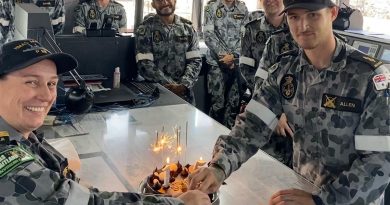 Commanding Officer HMAS Maitland Lieutenant Commander Julia Griffin and Able Seaman Samuel Allen prepare to cut a cake celebrating the Armidale-class patrol boat's 15th birthday. Story by Lieutenant Liam Feenan.