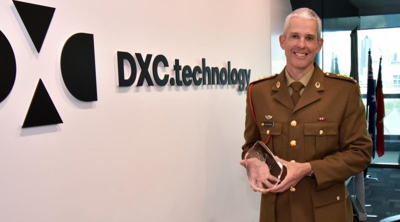 Army reservist Captain Gareth Morgan receives the Prince of Wales Award at his workplace, DXC Technology, in Fortitude Valley, Brisbane. Story by Captain Evita Ryan.
