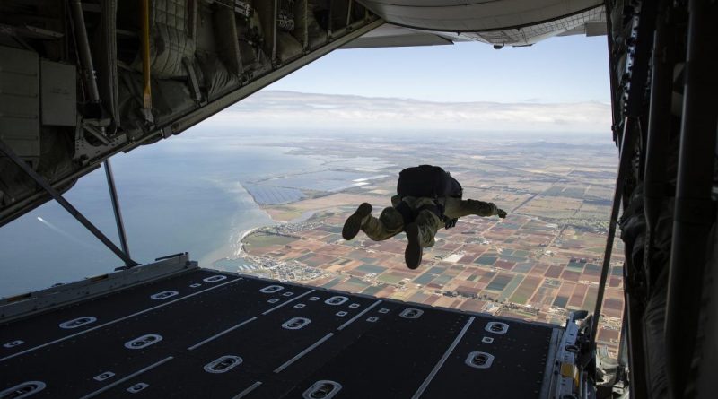 An Australian Army special operations forces soldier conducts a military free-fall parachute jump from a Royal Australian Air Force C-130J Hercules aircraft near RAAF Base Williams. Story by Major Darren Elder. Photo by Sergeant Jake Sims.