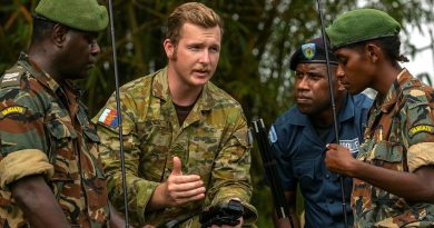 Lance Corporal Ryan Davies speaks with Vanuatu Police Force members Corporal Alex Sope, left, Constable Simeon Samuel and Private Georgette Kalorib during training with the Barrett 4090 High Frequency Man-Pack Radio. Story by Captain Taylor Lynch. Photo by Corporal Kieren Whiteley.