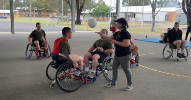 Veteran engagement specialist from Invictus Australia, Rachael Kerrigan, umpires a wheelchair basketball game with soldiers from the School of Infantry at an adaptive sport demonstration event at Singleton, NSW. Story by Major Carrie Robards.