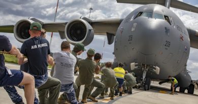 No. 36 Squadron aviators pull a C-17A Globemaster III aircraft during the tug-o-war challenge at RAAF Base Amberley. Story by Flying Officer Lily Lancaster. Photo by Corporal Jesse Kane.