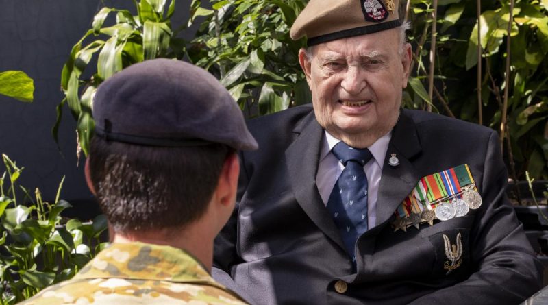 Australian Army soldier Corporal A, from the 1st Commando Regiment, talks with Second World War British Army veteran Mr John Morris in the garden of his home in Merrylands, Sydney. Photo by Chief Petty Officer Cameron Martin.
