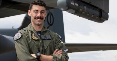 Flying Officer Johnathan Gough, a Combat Systems Officer with No. 37 Squadron, stands in front of a C-130J Hercules aircraft which is fitted with a Litening sensor pod on its wing. Story by Eamon Hamilton. Photo by Corporal Kylie Gibson.