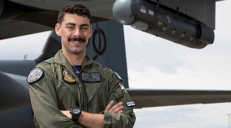 Flying Officer Johnathan Gough, a Combat Systems Officer with No. 37 Squadron, stands in front of a C-130J Hercules aircraft which is fitted with a Litening sensor pod on its wing. Story by Eamon Hamilton. Photo by Corporal Kylie Gibson.