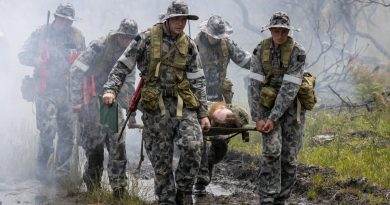 (Left) Royal Australian Naval College New Entry Officers' Course 65 Midshipman Stuart Munro and Midshipman Ellen Kozlowska carry the front of a stretcher after rescuing an unconscious pilot during a training scenario for Exercise Matapan at HMAS Creswell. Story by Private Jacob Joseph.