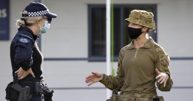 Australian Army Captain Celie Bright-Perry speaks with an AFP health planner during their deployment to Solomon Islands. Story by Corporal Brodie Cross. Photo by Corporal Brandon Grey.