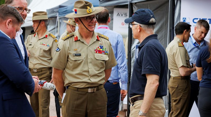 Chief of Army, Lieutenant General Rick Burr, AO, DSC, MVO, speaks with an Australian industry employee at the C4-EDGE capability display at Russell Offices in Canberra. Story by Captain Sarah Kelly. Photo by Sergeant Cameron Pegg.