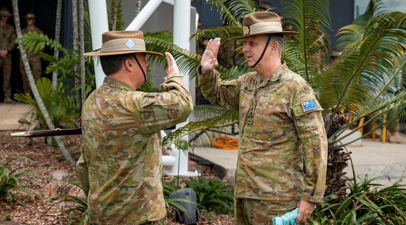 Outgoing Commander of the 7th Brigade, Brigadier Jason Blain, right, receives the brigade pennant from Regimental Sergeant Major Warrant Officer Class One Matthew Bold at Gallipoli Barracks, Brisbane. Story by Captain Jesse Robilliard. Photo by Corporal Nicole Dorrett.