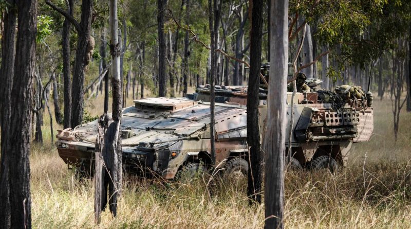 A Boxer Combat Reconnaissance Vehicle conducts a live-fire battle run during exercise Diamond Walk at Shoalwater Bay, Queensland. Story by Lieutenant Colonel Phil Pyke. Photo by Private Jacob Hilton.