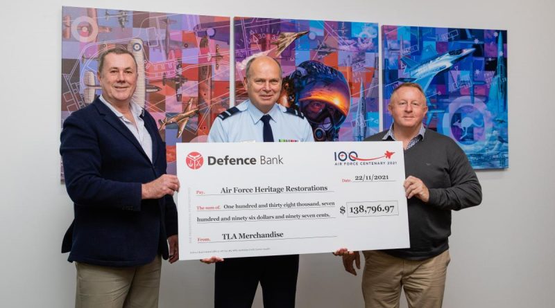 CEO of The Air Force Shop Stephen Davie, left, Director General Air Force 2021 Air Commodore Andrew Elfverson and General Manager TLA Merchandise Terry Wilson at the presentation of funds raised through Air Force centenary merchandise sales. Story by Squadron Leader Bruce Chalmers.