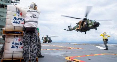 A MRH-90 Taipan launches from the flight deck of HMAS Adelaide to drop disaster relief supplies to Nabouwalu on the island of Vanua Levu, Fiji, during Operation Fiji Assist. Story by Captain Jessica O’Reilly. Photo by Corporal Dustin Anderson.