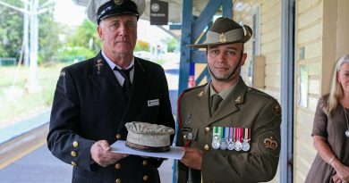 Former Navy paramedic Jamie Hodgess, left, and his nephew Army petroleum operator Warrant Officer Class Two Stuart Hodgess with the Navy hat that belonged to Jamie Hodgess' father, Gus. Story by Captain Thomas Kaye . Photo by Lance Corporal Christopher Smith.