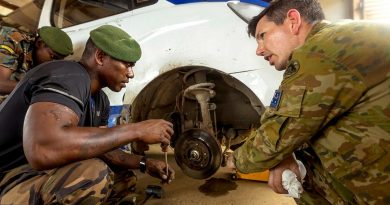 Australian Army Sergeant Dale Daff and Vanuatu Police Force Private John Pierre work on a vehicle during the vehicle maintainers' course at Cook Barracks in Port Vila, Vanuatu. Story by Captain Taylor Lynch. Photo by Corporal Robert Whitmore.
