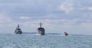 HMAS Armidale, left, and Papua New Guinea’s new Guardian-class patrol boat NUSHIP Francis Agwi, middle, in Darwin Harbour. Story by Lieutenant Brendan Trembath.