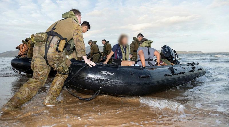 Soldiers from the 2nd Battalion, Royal Australian Regiment, prepare to take participants of the Proud Warrior Youth Engagement Program for a ride in the Zodiac MK2 inflatable boat at Pallarenda Beach, Queensland, in September. Story by Captain Lily Charles. Photo by Corporal Brandon Grey.