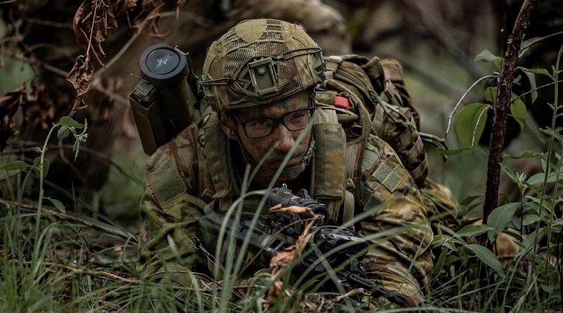 Private Eric Curll, from the 8th/9th Battalion, Royal Australian Regiment, scans the Enoggera Close Training Area for enemy role-players during Exercise Ram Strike. Story by Captain Jesse Robilliard. Photo by Private Jacob Hilton.