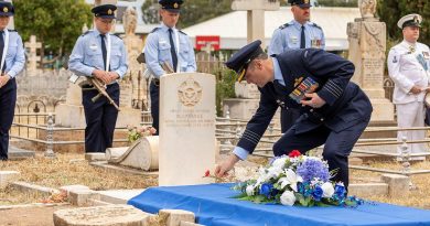 Officer Commanding No. 92 Wing Group Captain John Grime lays a poppy at the grave of Flying Officer Maxwell Pearce in Salisbury, South Australia. Story by Flight Lieutenant Nat Giles. Photo by Leading Aircraftman Stewart Gould.