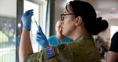 Private Christie Rayner, from Joint Health Unit – North Queensland prepares a COVID-19 vaccine at the Blue Care Aged Care facility in Ingham, Queensland, in March.