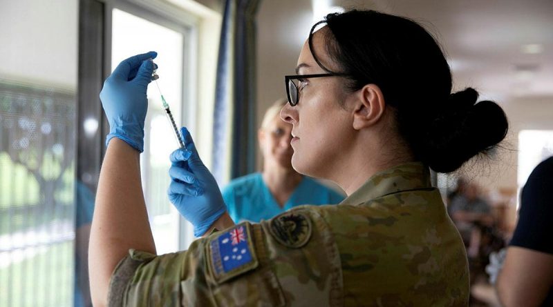 Private Christie Rayner, from Joint Health Unit – North Queensland prepares a COVID-19 vaccine at the Blue Care Aged Care facility in Ingham, Queensland, in March.