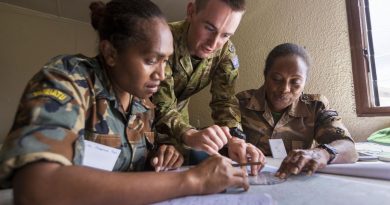 Australian Army Lieutenant Matthew Taylor assists Vanuatu Police Force Corporals Josephine Fred, left, and Kimason Doro with navigation training during the Sergeants Course at Cook Barracks, Port Vila. Story by Captain Taylor Lynch. Photo by Corporal Robert Whitmore.