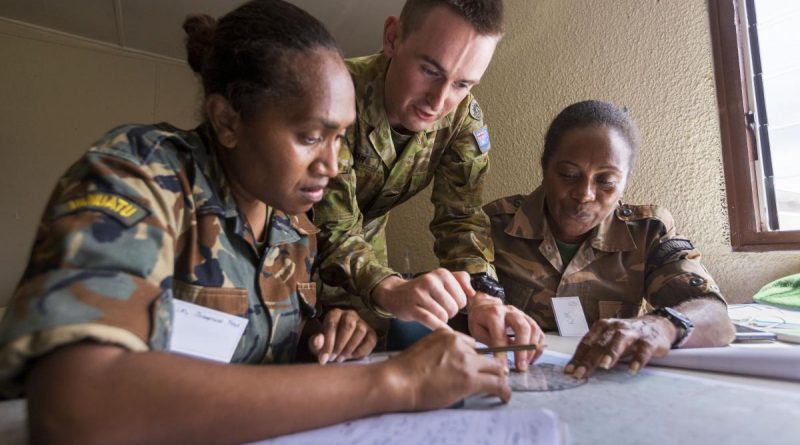 Australian Army Lieutenant Matthew Taylor assists Vanuatu Police Force Corporals Josephine Fred, left, and Kimason Doro with navigation training during the Sergeants Course at Cook Barracks, Port Vila. Story by Captain Taylor Lynch. Photo by Corporal Robert Whitmore.