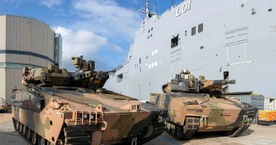 The Hanwha Defense Australia Redback, left, and the Rheinmetall Defence Australia KF-41 Lynx next to HMAS Adelaide at HMAS Kuttabul. Photo by Able Seaman Benjamin Ricketts.