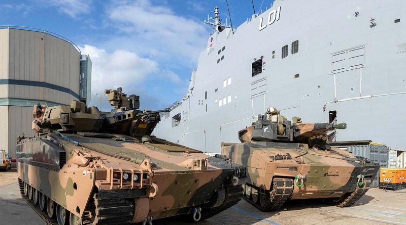 The Hanwha Defense Australia Redback, left, and the Rheinmetall Defence Australia KF-41 Lynx next to HMAS Adelaide at HMAS Kuttabul. Photo by Able Seaman Benjamin Ricketts.