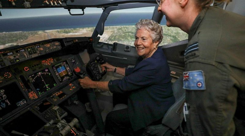 Former Women's Royal Australian Air Force member Valarie Rappold is shown how to fly the P-8 Poseidon simulator by No. 11 Squadron pilot Flight Lieutenant Larissa Stephens at RAAF Base Edinburgh. Story by Flight Lieutenant Nat Giles. Photo by Corporal Brenton Kwaterski.