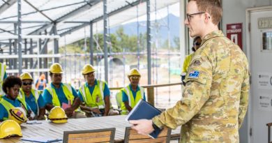 Army officer Captain Cameron Laing provides a site brief to Fijian TAFE students at the Blackrock Redevelopment Project in Fiji.