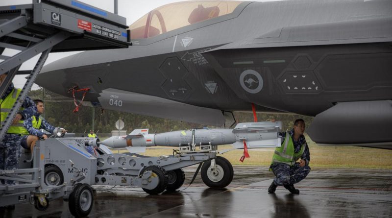 Armament Technicians from No. 3 Squadron, load a new Australian manufactured Bomb Live Unit (BLU 111) configured as a Guided Bomb Unit (GBU-12) onto F-35A Lightning II aircraft A35-040 at RAAF Base Williamtown, NSW. Story by Flying Officer Bronwyn Marchant. Photo by Corporal Craig Barrett.