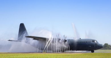 The first No. 37 Squadron C-130J Hercules with Block 8.1 upgrades taxis through the bird bath after returning to RAAF Base Richmond. Photo by Corporal David Said