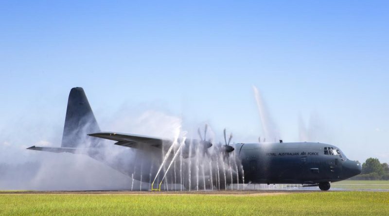 The first No. 37 Squadron C-130J Hercules with Block 8.1 upgrades taxis through the bird bath after returning to RAAF Base Richmond. Photo by Corporal David Said