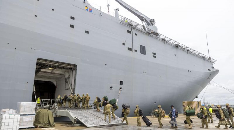 ADF personnel embark onto HMAS Adelaide at the Port of Brisbane before departure on Operation Tonga Assist 2022. Story by Captain Zoe Griffyn. Photo by Corporal Robert Whitmore.