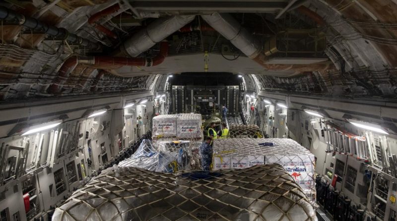 Pallets of humanitarian assistance and engineering equipment bound for Tonga, are loaded onto a RAAF C-17A Globemaster III, at RAAF Base Amberley. Story by Eamon Hamilton. Photo by Leading Aircraftwoman Emma Schwenke.