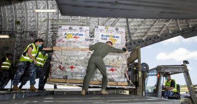 RAAF personnel unload humanitarian assistance and engineering equipment from a C-17A Globemaster III aircraft at Fua’amotu international airport in Tonga. Photo by Leading Aircraftwoman Emma Schwenke.