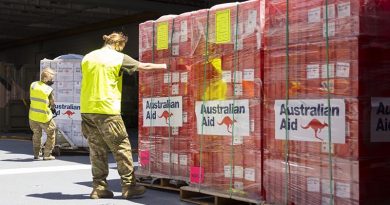 Humanitarian assistance and disaster relief stores are prepared for offloading as HMAS Adelaide sails into Tonga during Operation Tonga Assist 22. Photo by Corporal Robert Whitmore.