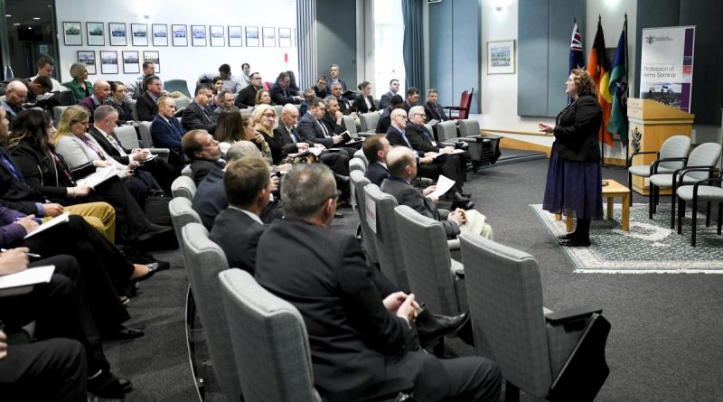 Dr Lacy Pejcinovic welcomes guests to the Profession of Arms Seminar at the Australian Defence College, Weston Creek, Canberra. Story by Sofija Brown. Photo by Grace Costa Banson.