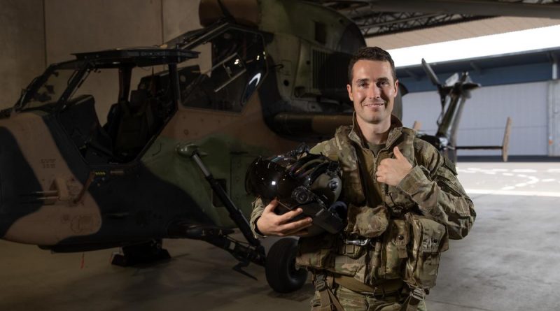 Army pilot Captain Shaun Gill in front of a Tiger armed reconnaissance helicopter from 1st Aviation Regiment at Robertson Barracks, NT. Story by Captain Carolyn Barnett. Photo by Corporal Rodrigo Villablanca.