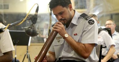 Air Force officer Flight Lieutenant Tjapukai Shaw plays the didgeridoo during the new Australian national anthem recording at Alan Eaton Studios in Melbourne, Victoria. Story by Leading Seaman Kylie Jagiello. Photo by Petty Officer Nina Fogliani.