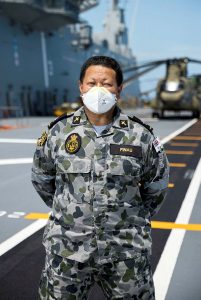 Royal Australian Navy officer Chaplain Simote Finau on the flight deck of HMAS Adelaide during Operation Tonga Assist 2022. Photo by Corporal Robert Whitmore.