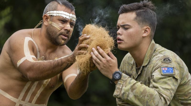 Private Raymond Gunning from 10th Force Support Battalion and Mr Les Tanna from the Wulgurukaba Walkabouts during the totem ceremony in Townsville. Story by Captain Annie Richardson. Photo by Corporal Brodie Cross.