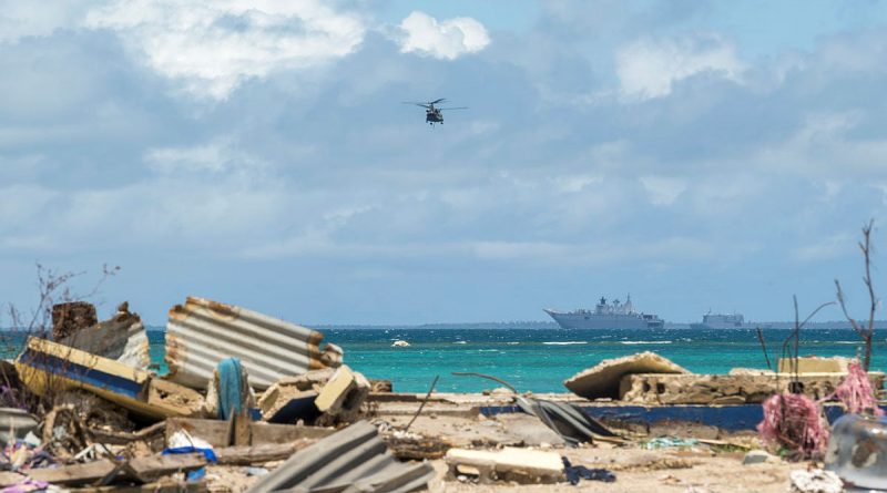 An Australian Army CH-47F Chinook helicopter returns to HMAS Adelaide after air-lifting disaster relief stores to Atata Island in Tonga during Operation Tonga Assist 2022. Story by Lieutenant Brendan Trembath. Photo by Corporal Robert Whitmore.
