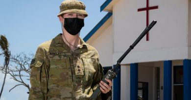 Lieutenant Lauren Barclay outside the Wesleyan church on Atata Island, Tonga. Story by Captain Zoe Griffyn. Photo by Leading Seaman David Cox.