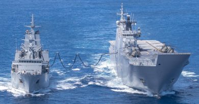 HMAS Supply (left) and HMAS Adelaide conduct a replenishment at sea during Operation Tonga Assist 2022. Story by Captain Zoe Griffyn. Photo by Corporal Robert Whitmore.