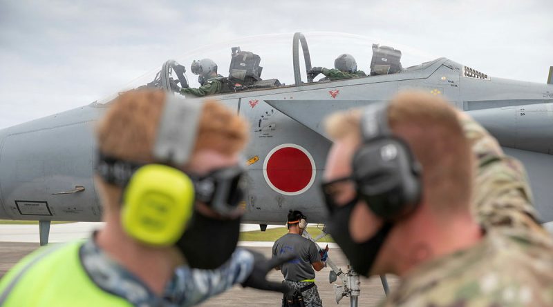 Leading Aircraftman Ronan Geoghgan (left) from No. 23 Squadron and a United States airman prepare to refuel a Japan Air Self-Defense Force (Koku-Jieitai) F-15J Eagle aircraft during Exercise Cope North. Story by Flying Officer Bronwyn Marchant. Photo by Leading Aircraftman Sam Price.