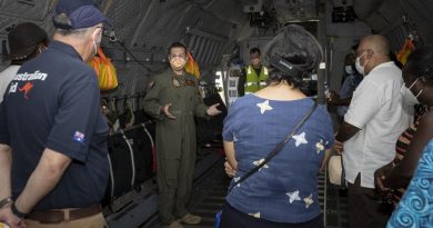 RAAF pilot Squadron Leader Justin Della Bosca gives Solomon Islands Government officials a tour inside a C-27J Spartan aircraft at Honiara international airport, Solomon Islands. Story by Captain Peter March. Photo by Corporal Jarrod McAneney.