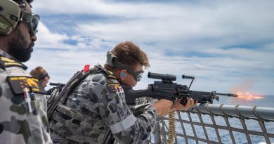 Leading Seaman Nathan Bob, left, directs Able Seaman Bradley Hocking as he fires an F89 Minimi on the flight deck of HMAS Arunta in the lead-up to the ship's regional presence deployment. Story and photo by Leading Seaman Sittichai Sakonpoonpol.