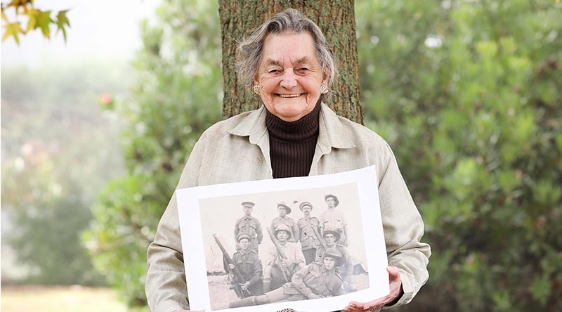 Private Edward Attfield’s great-niece, Beverley Warren, holds a photo featuring Private Attfield, who is believed to be the digger lying down. Photo by Able Seaman Bonny Gassner.